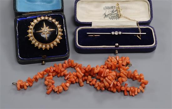 An Edwardian 15ct and diamond bar brooch, a Victorian seed pearl and enamel brooch and a coral necklace.